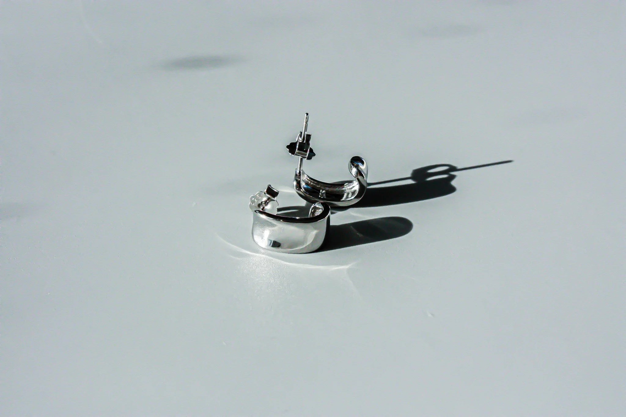 J Curve Earrings