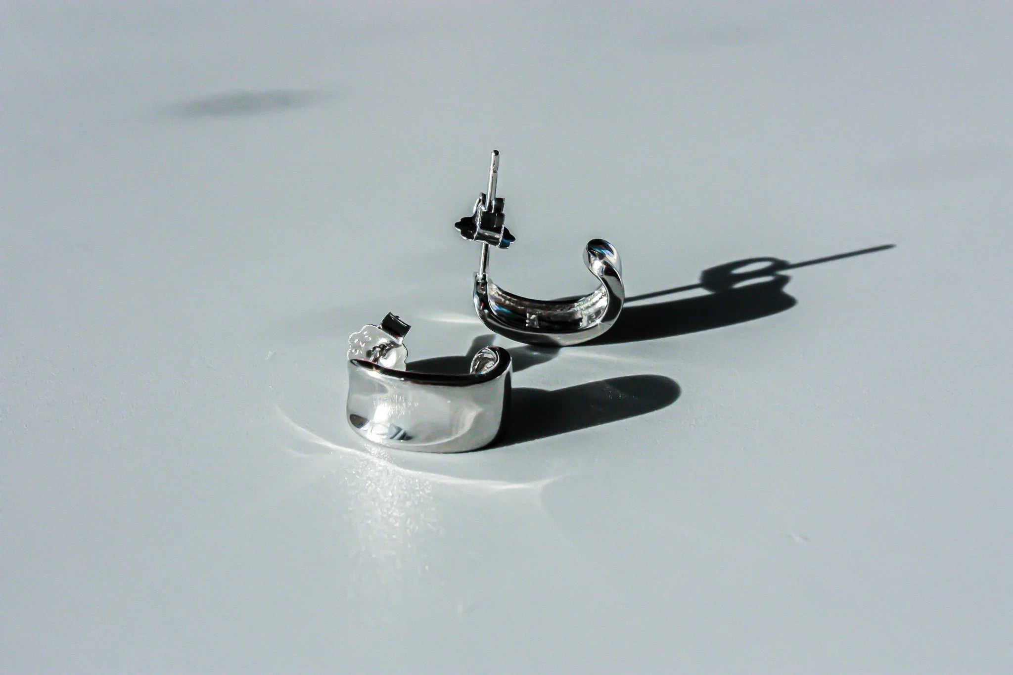 J Curve Earrings