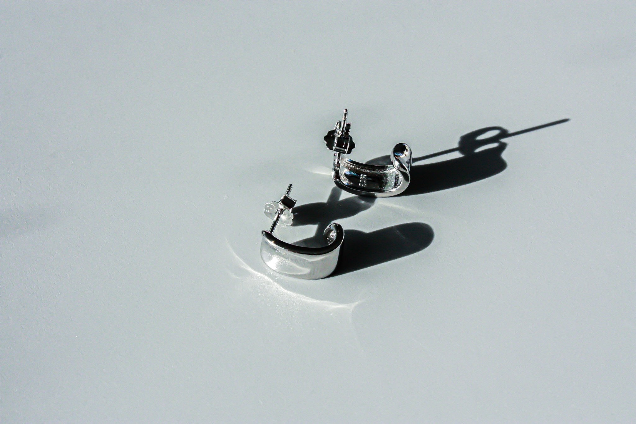 J Curve Earrings